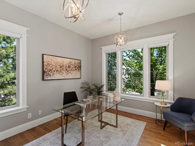 6995 S Ensenada St, Aurora, CO 80016 - office space featuring a chandelier, baseboards, and wood finished floors