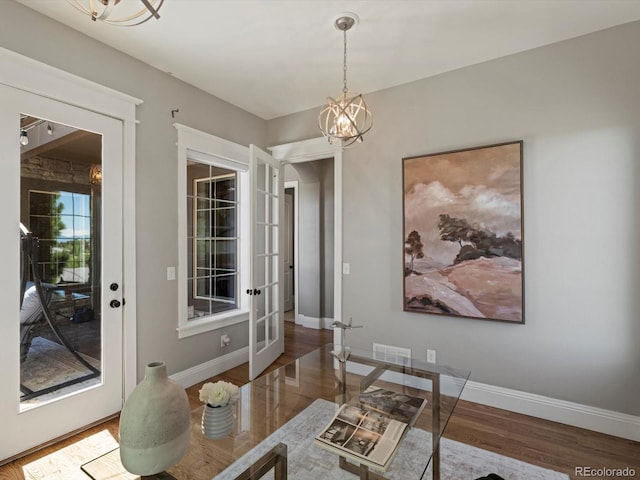 6995 S Ensenada St, Aurora, CO 80016 - office space with a chandelier, wood finished floors, french doors, and baseboards