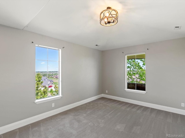 6995 S Ensenada St, Aurora, CO 80016 - carpeted spare room featuring baseboards