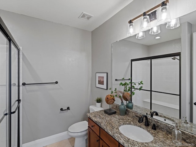 6995 S Ensenada St, Aurora, CO 80016 - bathroom featuring vanity, a shower stall, toilet, tile patterned floors, and baseboards