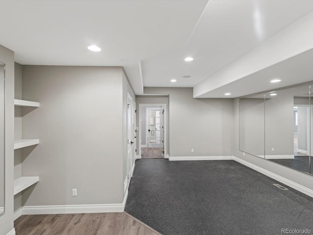 6995 S Ensenada St, Aurora, CO 80016 - basement featuring baseboards, recessed lighting, and wood finished floors