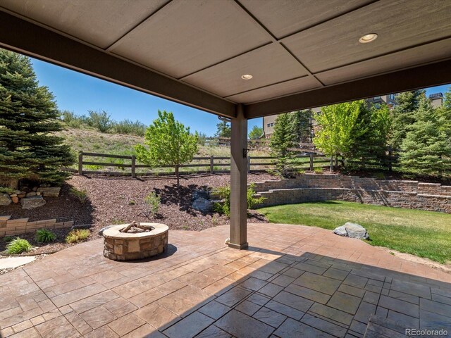 6995 S Ensenada St, Aurora, CO 80016 - view of patio / terrace featuring a fire pit