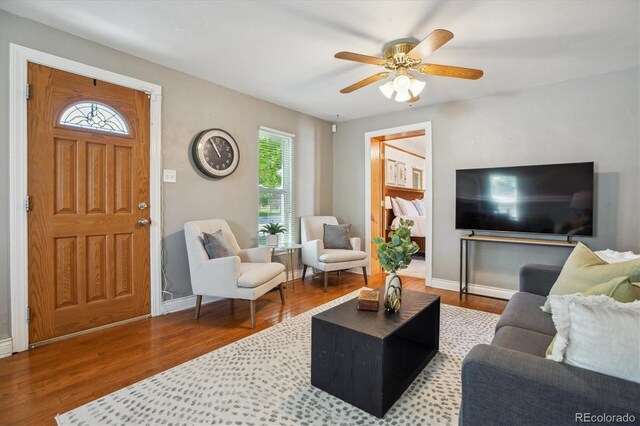 2311 W 46th Ave, Denver, CO 80211 - living area with wood finished floors, ceiling fan, and baseboards