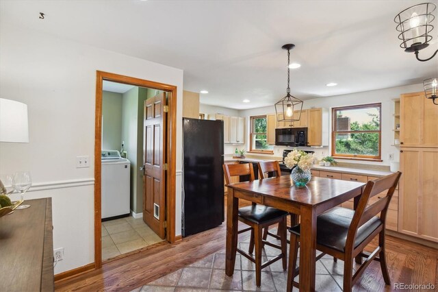 2311 W 46th Ave, Denver, CO 80211 - dining area with washer / clothes dryer, light wood-style floors, recessed lighting, and baseboards