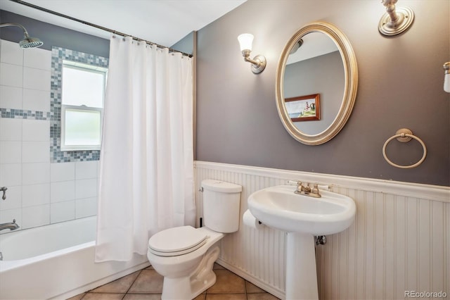 2311 W 46th Ave, Denver, CO 80211 - full bathroom featuring wainscoting, toilet, shower / bath combo with shower curtain, and tile patterned flooring