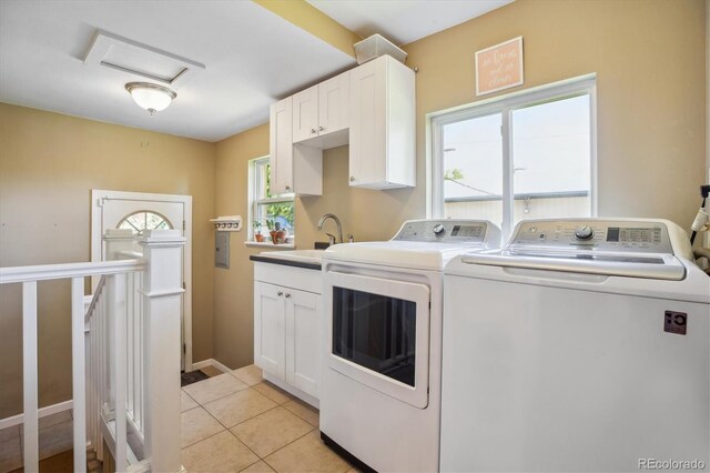 2311 W 46th Ave, Denver, CO 80211 - washroom with independent washer and dryer, attic access, light tile patterned flooring, cabinet space, and baseboards