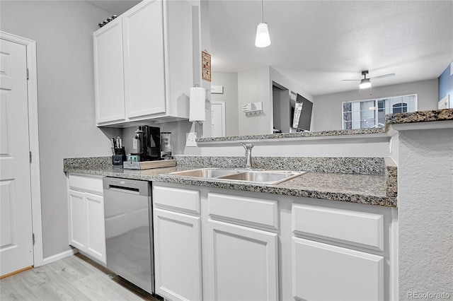 17442 Nature Walk Trl Unit 105, Parker, CO 80134 - kitchen featuring dishwasher, white cabinetry, light wood-style floors, and hanging light fixtures