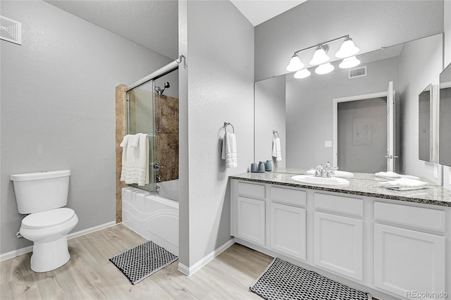 17442 Nature Walk Trl Unit 105, Parker, CO 80134 - full bathroom featuring vanity, wood finished floors, and shower / bath combination with glass door