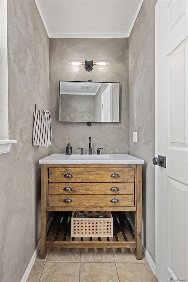 bathroom with vanity and crown molding