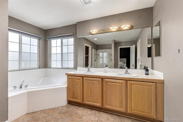 bathroom featuring plus walk in shower and vanity