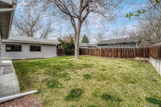 view of yard with a fenced backyard