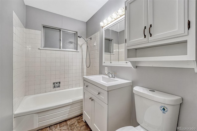 full bath with toilet, vanity, and  shower combination