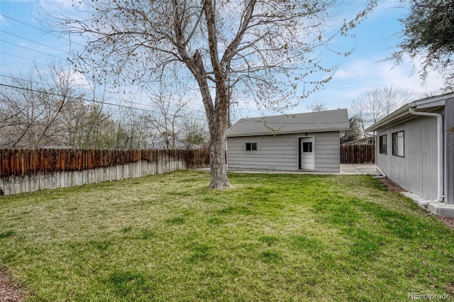 view of yard with a fenced backyard
