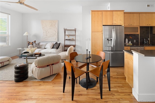 340 S Lafayette St Unit 201, Denver, CO 80209 - dining room featuring light wood finished floors, baseboards, and a ceiling fan