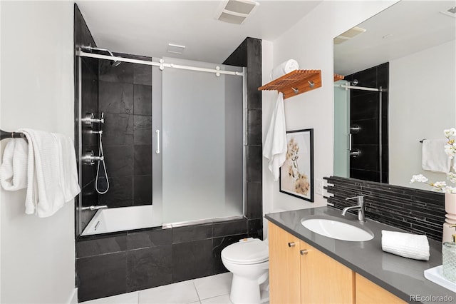 340 S Lafayette St Unit 201, Denver, CO 80209 - bathroom with tile patterned flooring, tiled shower / bath combo, vanity, and toilet