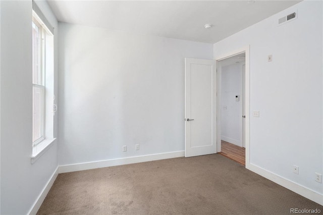 340 S Lafayette St Unit 201, Denver, CO 80209 - carpeted spare room featuring healthy amount of natural light and baseboards