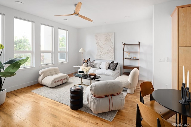 340 S Lafayette St Unit 201, Denver, CO 80209 - living room featuring light wood finished floors, ceiling fan, and baseboards