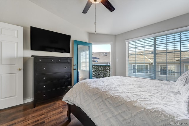 bedroom featuring access to exterior, dark wood-type flooring, and ceiling fan