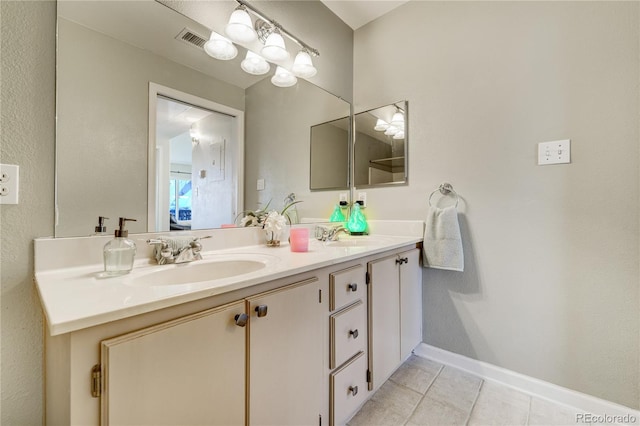 bathroom featuring vanity and tile patterned flooring