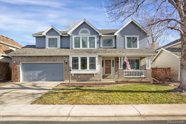 view of front of home featuring a porch, a garage, and a front lawn