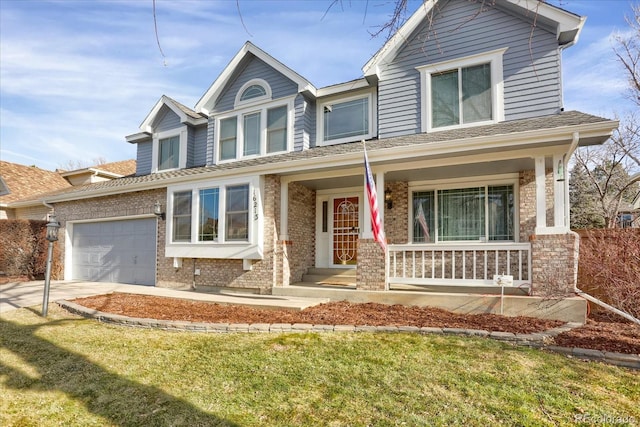 view of front facade featuring covered porch, a garage, and a front lawn