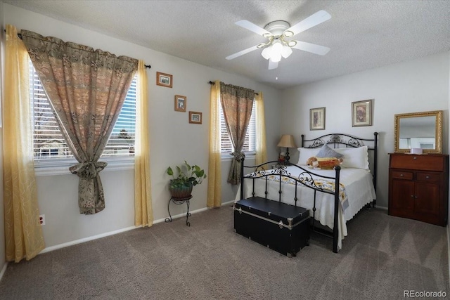 bedroom featuring ceiling fan, a textured ceiling, and carpet flooring