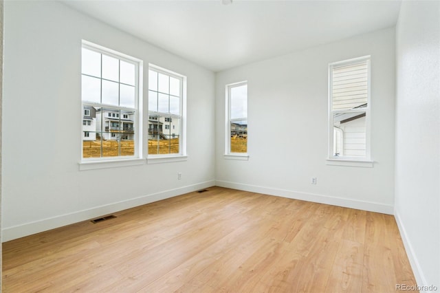 9322 Quaker St, Arvada, CO 80007 - empty room with baseboards, light wood finished floors, and visible vents