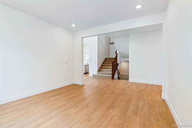 9322 Quaker St, Arvada, CO 80007 - empty room with baseboards, light wood-style floors, stairs, and recessed lighting
