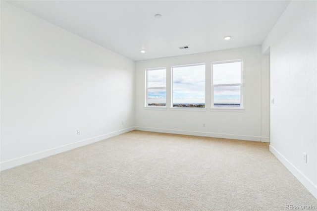 9322 Quaker St, Arvada, CO 80007 - empty room featuring light carpet, baseboards, visible vents, and recessed lighting