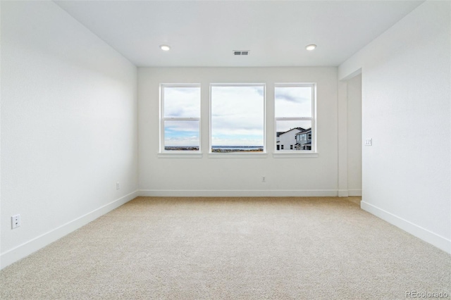 9322 Quaker St, Arvada, CO 80007 - unfurnished room with baseboards, visible vents, recessed lighting, and light colored carpet