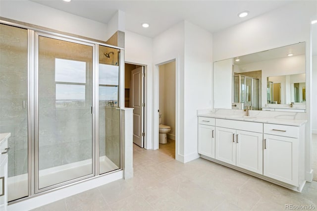 9322 Quaker St, Arvada, CO 80007 - full bath with a stall shower, recessed lighting, toilet, and vanity