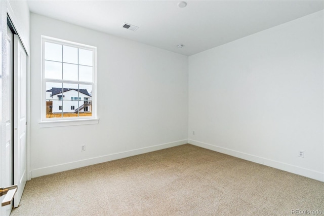 9322 Quaker St, Arvada, CO 80007 - carpeted spare room featuring baseboards and visible vents
