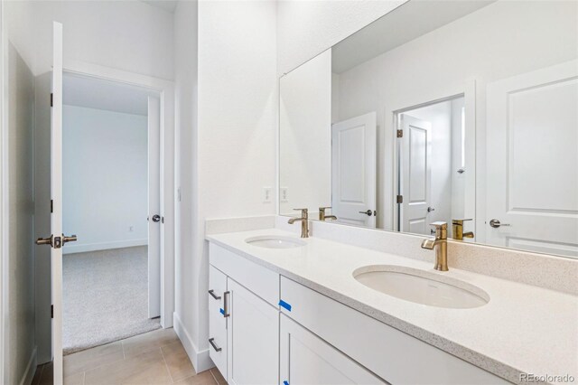 9322 Quaker St, Arvada, CO 80007 - bathroom with double vanity, a sink, and tile patterned flooring