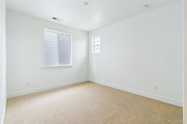 9322 Quaker St, Arvada, CO 80007 - spare room with light carpet, baseboards, and visible vents