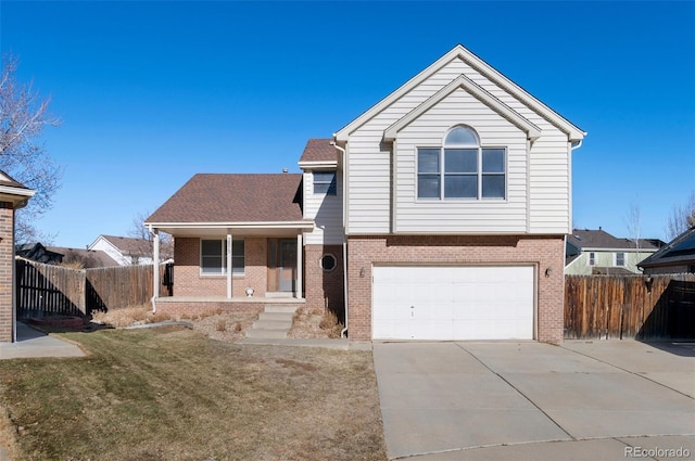 view of front of house with driveway, a porch, fence, and brick siding