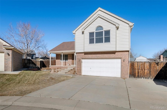 view of front of house featuring brick siding, concrete driveway, covered porch, fence, and a garage