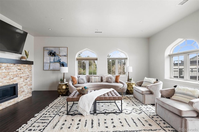 living room featuring a fireplace and hardwood / wood-style floors