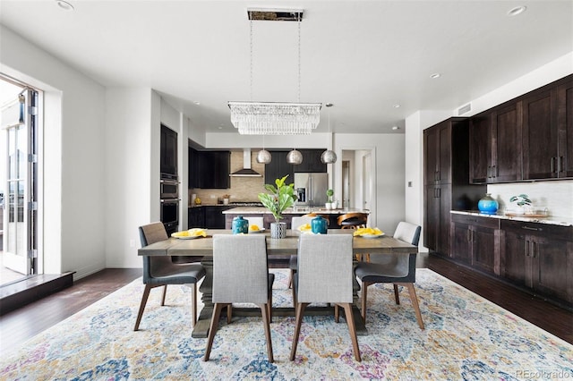 dining space featuring dark hardwood / wood-style floors