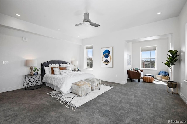 bedroom with dark carpet and ceiling fan