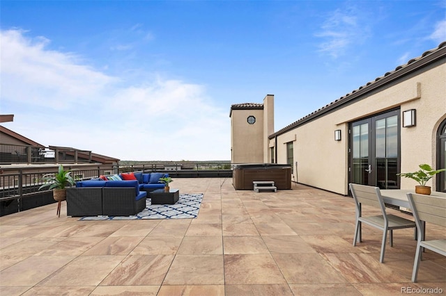 view of patio featuring an outdoor living space and a hot tub