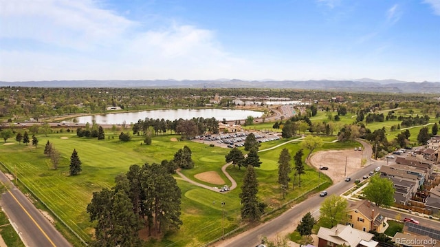 birds eye view of property with a water and mountain view