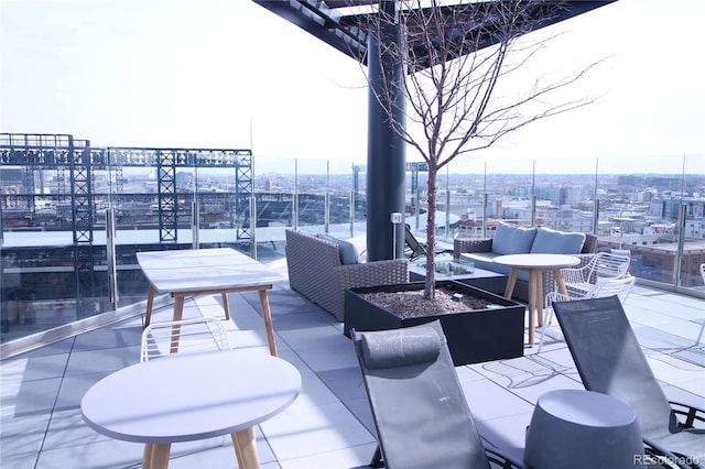 view of patio / terrace featuring an outdoor living space with a fire pit