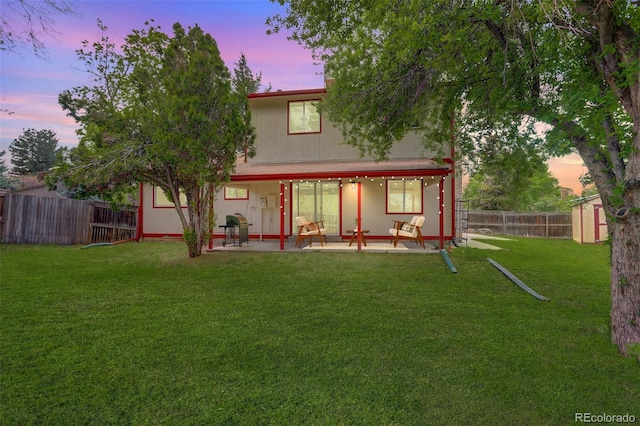 7552 Garland St, Arvada, CO 80005 - back of house featuring a patio area