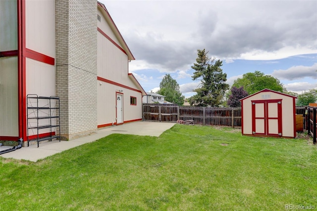 7552 Garland St, Arvada, CO 80005 - view of yard featuring a shed, an outdoor structure, and a patio