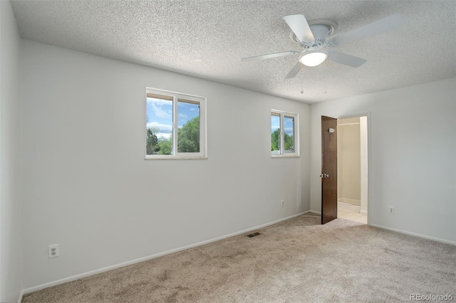 7552 Garland St, Arvada, CO 80005 - unfurnished bedroom featuring carpet flooring, a textured ceiling, baseboards, and a ceiling fan