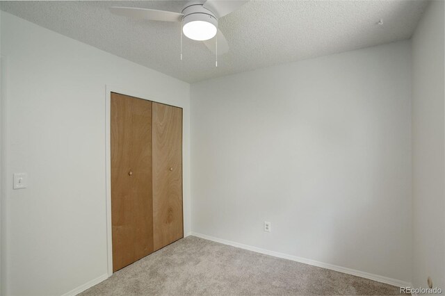 7552 Garland St, Arvada, CO 80005 - unfurnished bedroom with carpet, a closet, baseboards, a ceiling fan, and a textured ceiling