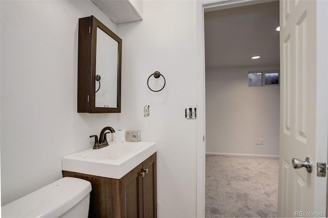 7552 Garland St, Arvada, CO 80005 - bathroom featuring vanity, toilet, recessed lighting, and baseboards