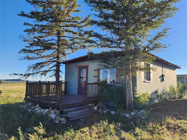 view of front of property with a wooden deck