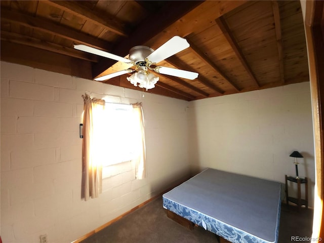 bedroom featuring dark colored carpet, ceiling fan, lofted ceiling with beams, and wooden ceiling