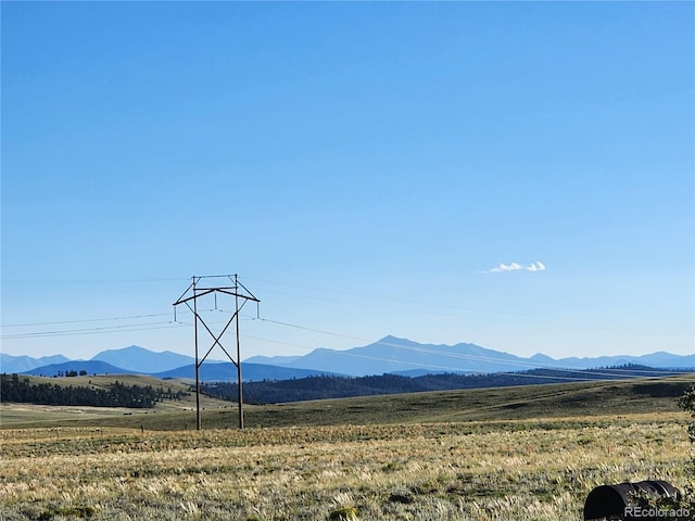 view of mountain feature with a rural view